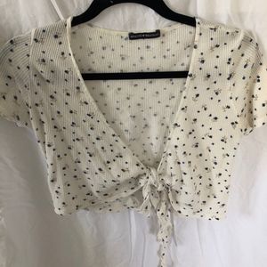 white wrap shirt with blue flowers